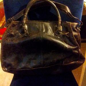 This is a large distressed handbag beautiful fine
